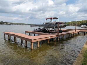 Your personal gateway to lake adventures; this private boat dock and boat slip.