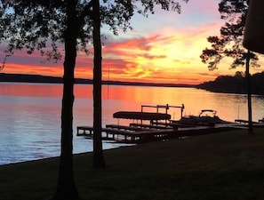 Experience the symphony of colors as the day ends from this lakeside sanctuary.