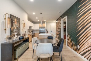 Dining table set to accommodate up to four guests.