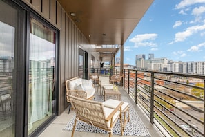 Large spacious patio off the living room and primary bedroom offering a gorgeous view of Music City!