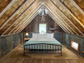 The Buck's Loft features a King sized bed and private sitting area.