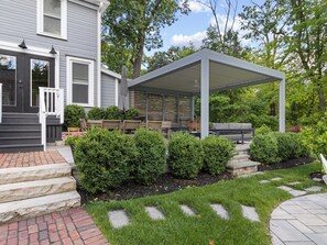 View of pergola and patio. 