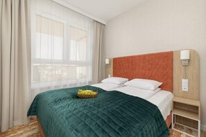 Bedroom with prepared bed.