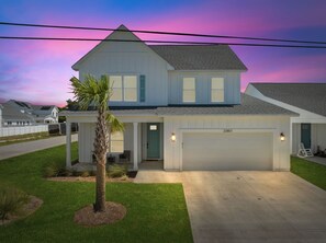 Front entrance with driveway and 2 car garage