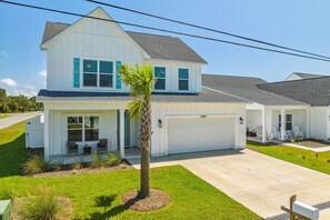 Front entrance with driveway and 2 car garage