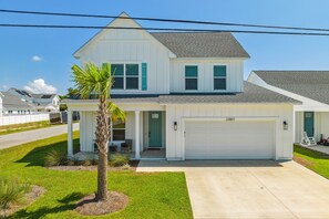 Front entrance with driveway and 2 car garage