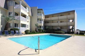 Stretch out on a lounge chair alongside this fabulous sparkling pool.