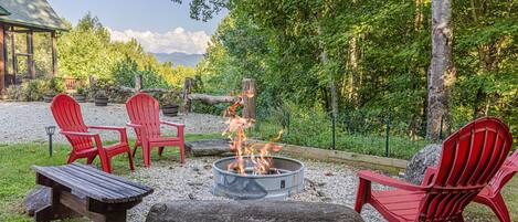 Large fire pit area with gorgeous mountain views and plenty of seating