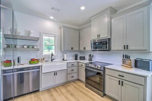 Full kitchen stocked with quality pots, pans, and utensils to prepare your favorite meals.