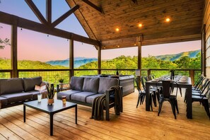 Experience outdoor living at its finest - amazing views, hot tub that seats 7, dining table for 12, sofas and outdoor TV and fireplace.