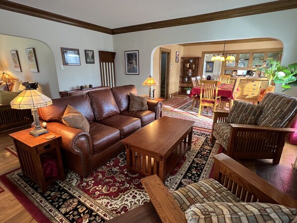 Original arches and crown molding are accentuated with period mission furniture.