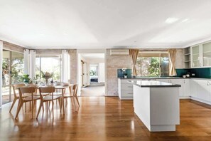 Open plan kitchen and dining, filled with natural light
