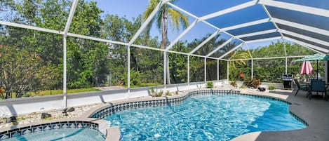 Large pool area with hot tub