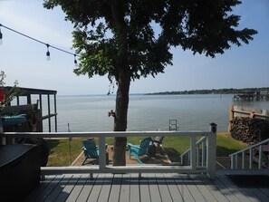 Wider view of fire pit and lake from the back porch.