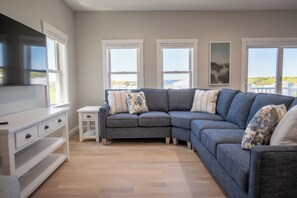 Living room with flat screen TV and sleep sofa