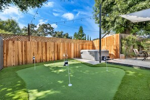 Putting Green next to jacuzzi and outdoor patio