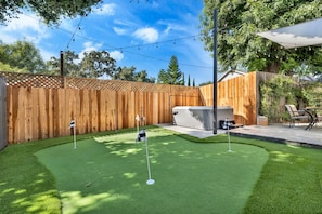 Putting Green next to jacuzzi and outdoor patio
