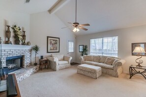 Stay at the best Airbnb in Ocean Springs! The spacious living area features premium fabric furniture, perfect for relaxing.