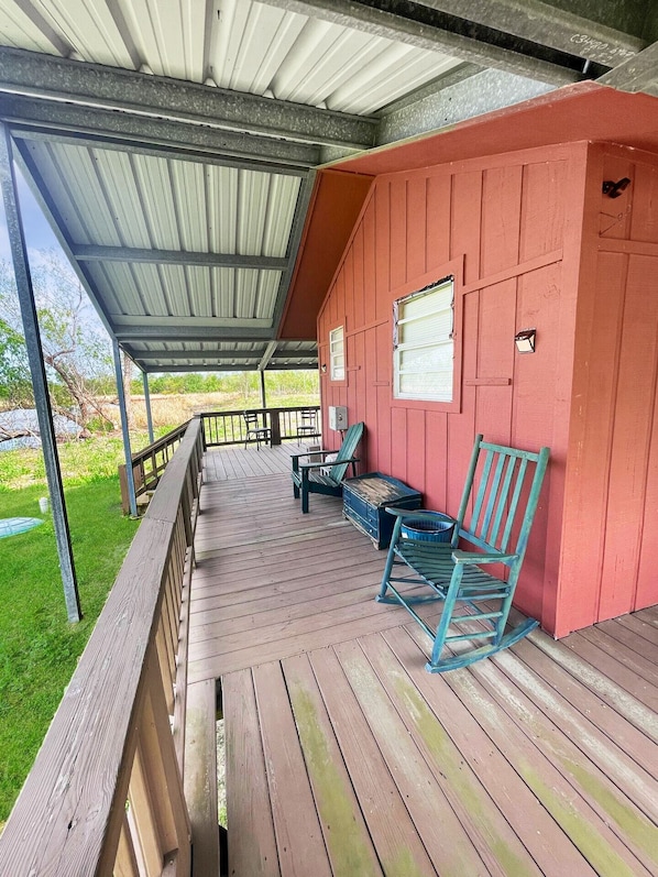A picturesque front view of the Cozy Cajun Cabin, showcasing its inviting entrance and charming architecture.