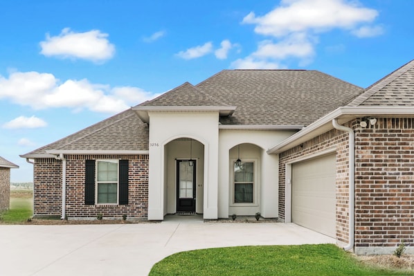 A gorgeous view of your next stay in an expertly maintained property, built after 2020. The house resides in a quiet neighborhood next to a newly developed golf course.