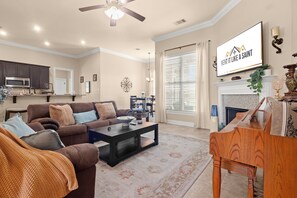 The best Airbnb in Lake Charles offers a spacious living room with comfortable seating for up to five guests on our Ashley linen sofa and loveseat, perfect for relaxing after a day of sightseeing or work.