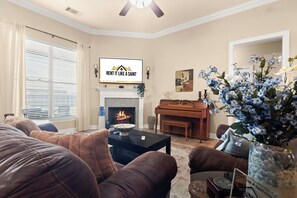 Stay at the best Airbnb in Lake Charles! Above the fireplace is a Vizio 65" Smart TV with Chromecast, perfect for streaming your favorite shows. High-speed wireless internet is available for all devices, ensuring seamless connectivity throughout your stay.