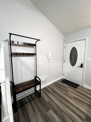 Entrance door and a hall tree with shoe storage 