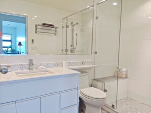 Private bathroom one step from the bedroom