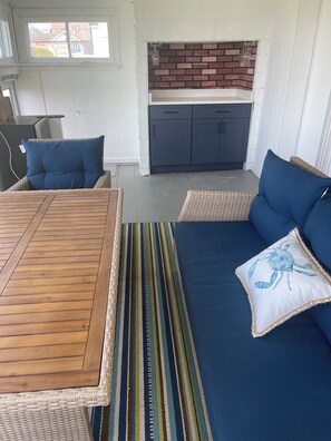 Sunroom with new wicker furniture and Bar area with mini fridge 