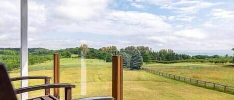 balcony off of primary bedroom with West Bay views!