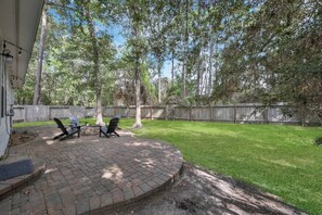 Enjoy the outdoor firepit in the peaceful backyard