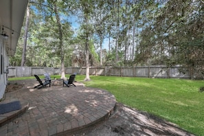Enjoy the outdoor firepit in the peaceful backyard