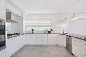 Lots of bench space for your preparation with double self cleaning ovens. Home away from home.