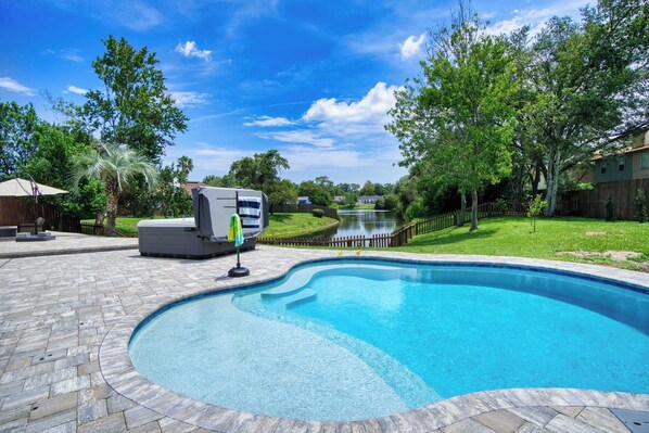 Relax by the private pool with scenic canal views and spacious outdoor patio.