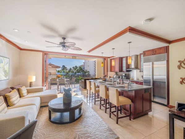 Open floor plan with eat-in kitchen looking out onto the lanai