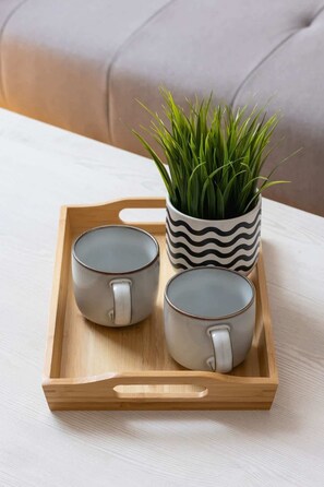 A detailed shot highlighting a coffee table with a minimalistic plant decor, reflecting the understated elegance of the interior design.