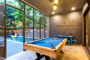 Relax And Play In This Poolside Game Area