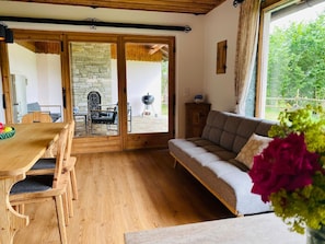 living and dining area with sofa bed