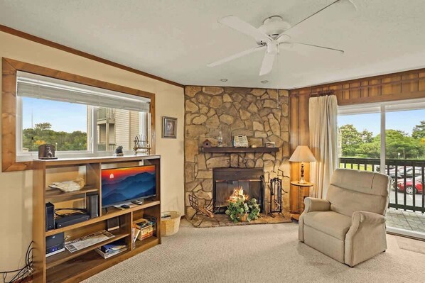 Relax in our cozy living room, featuring a plush couch and large windows that offer a stunning view.