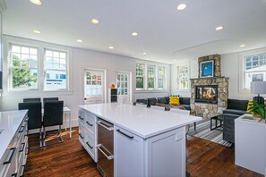 Bright, sunny, sparkling white kitchen and family room
