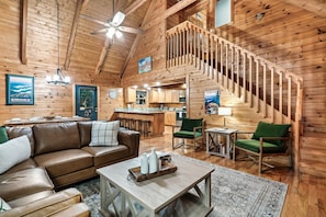 View of main floor living area leading to the upstairs master bedroom