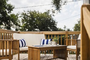 Unwind on the inviting patio, complete with stylish seating and a peaceful outdoor ambiance.