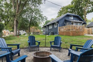 Gather around the cozy backyard firepit, surrounded by Adirondack chairs—ideal for evening conversations.