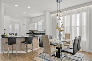 Bright and well-lit kitchen and dining area.