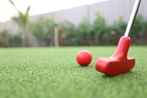 Unwind with a game: Step onto our private putting green, complete with all the equipment you need for a relaxing round, adding a touch of leisure to your Delray Beach escape.