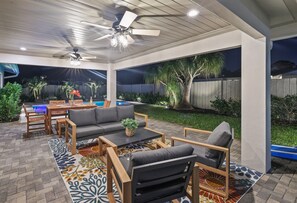 Al fresco elegance: Relax on our outdoor sofa, or gather around the spacious table that seats six on our covered terrace, just steps away from the inviting waters of our pool.