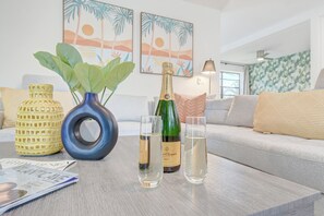 Elevate your Delray Beach escape with a toast: envision evenings with champagne in our elegant living room, the perfect backdrop for your Delray Beach adventure—your memorable moments await.