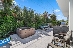 Discover endless fun in Delray Beach: Our backyard oasis features a hot tub, ping pong table, and cornhole—perfect for relaxation and entertainment during your stay.