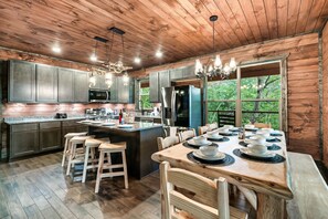 A large table and barstools available for group meals.