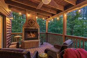 upper back deck with wood burning fireplace